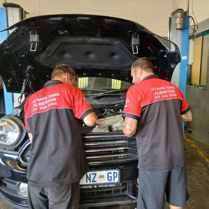 Technicians at work, repairing turbo 